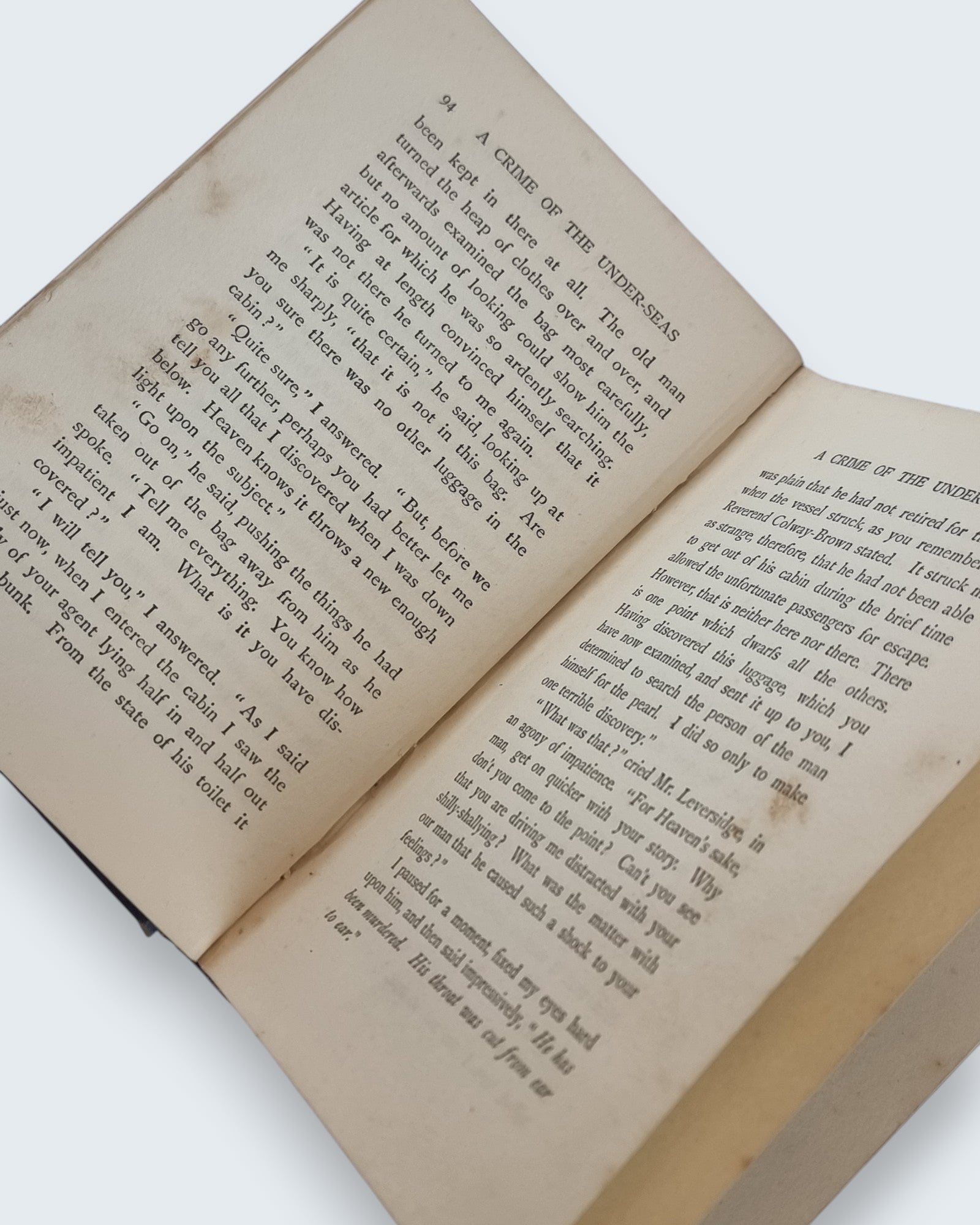 A Crime of the Under Seas Guy Boothby first edition vintage book open pages view