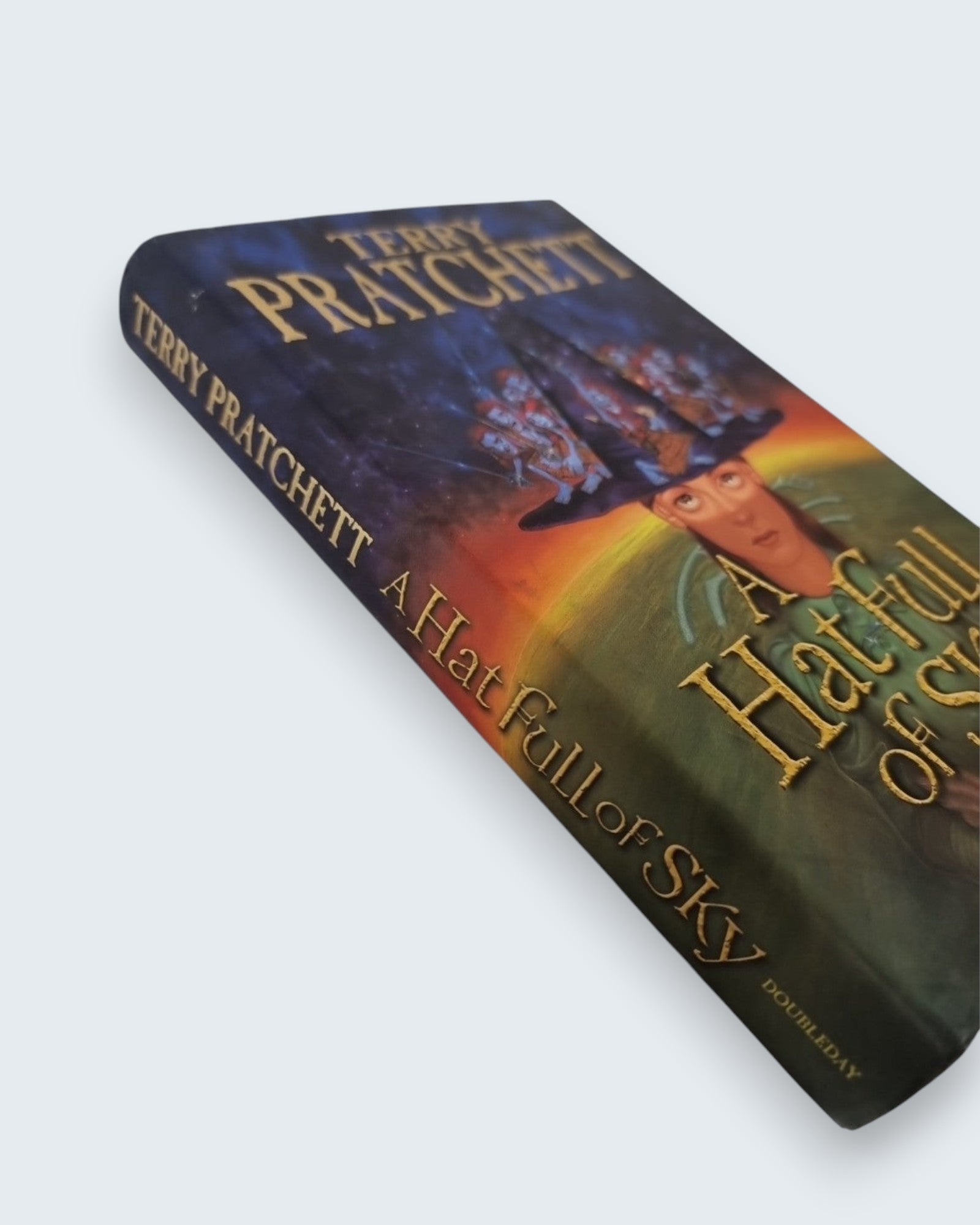 A Hat Full of Sky Terry Pratchett first edition vintage book laying angled view