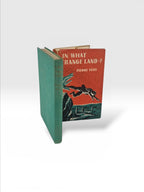 Broadhursts Books: In What Strange Land...? by Pierre Very, 1st Edition, 1949. Emerald green cloth binding with gilt lettering.