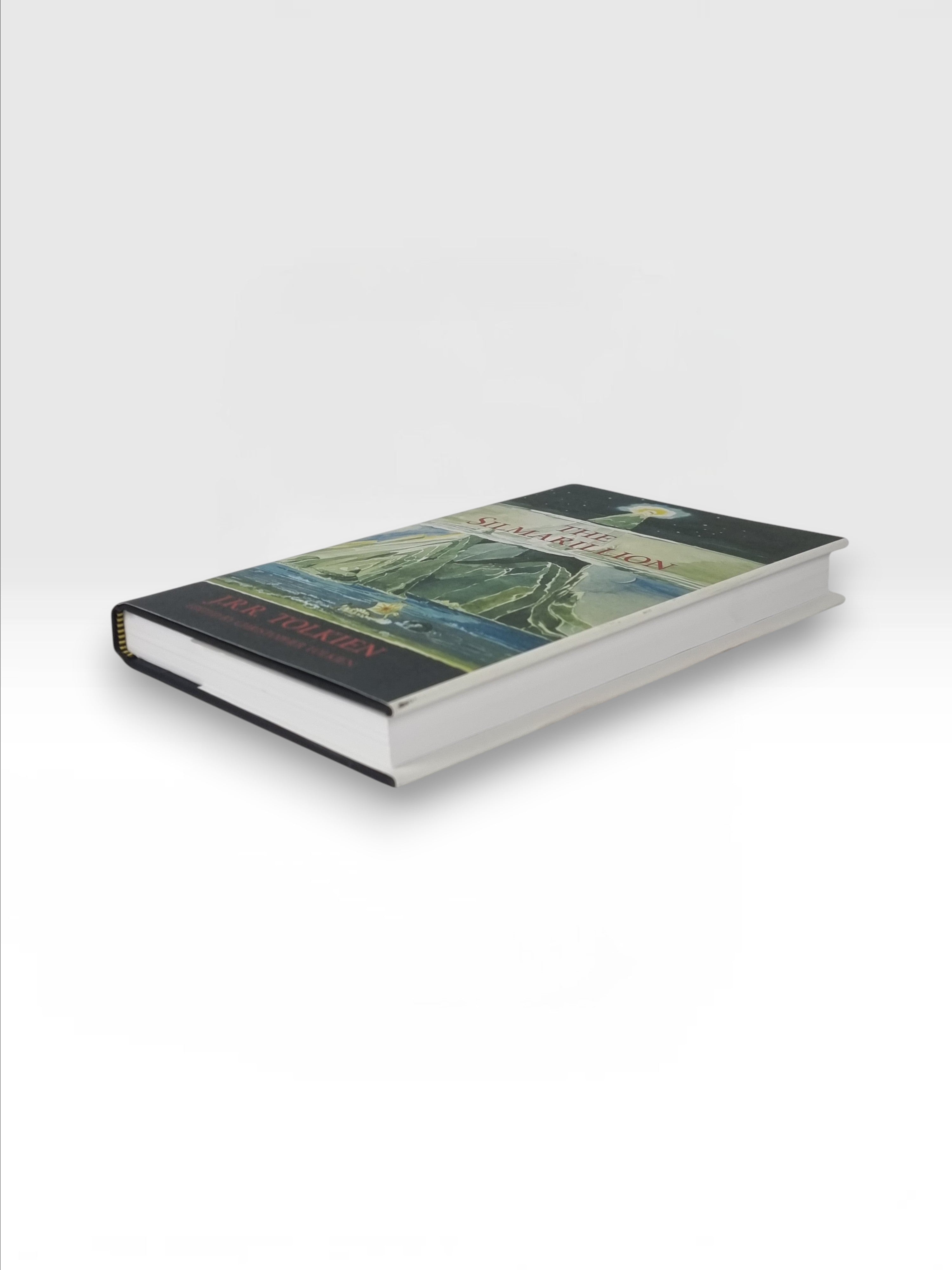 Broadhursts Books The Silmarillion by J.R.R. Tolkien, edited by Christopher Tolkien. Hardcover book with illustrated dust jacket.